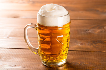 Beer mug on rustic wooden table