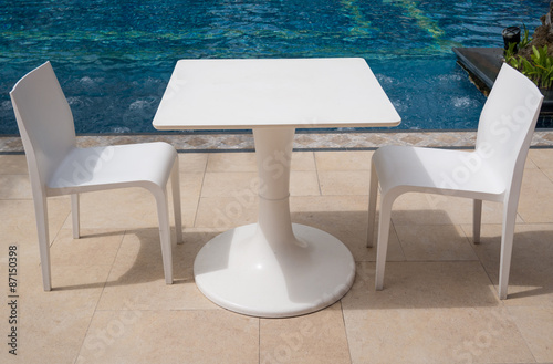 Table And Chair Near Swimming Pool Buy This Stock Photo