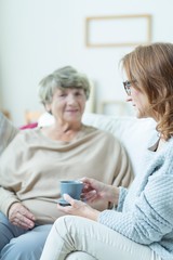 Canvas Print - Elderly woman during conversation