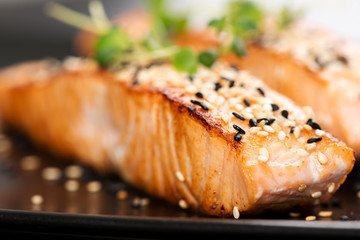 Wall Mural - Grilled salmon on black plate