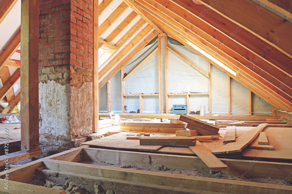 an interior view of a house attic under construction - obrazy, fototapety, plakaty 