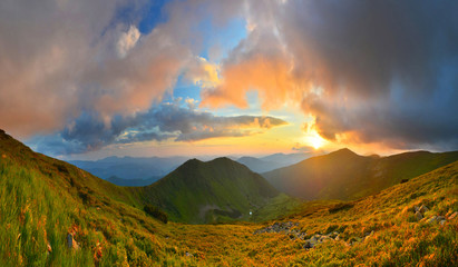 Wall Mural - sunset in summer mountains