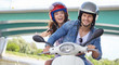© ZoomTeam - Cheerful couple riding vintage scooter