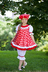 Wall Mural - Portrait of a charming little girl looking at camera