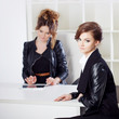 © Ulia Koltyrina - Young woman in the office with a colleague