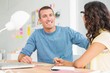 © WavebreakmediaMicro - Smiling man speaking to his colleague and looking at camera