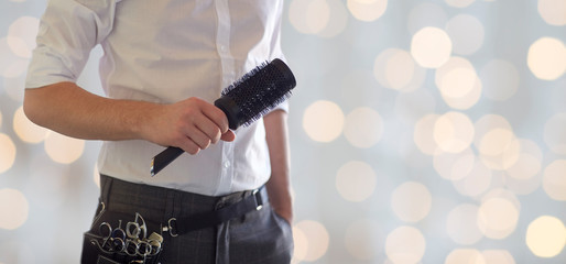 Poster - close up of male stylist with brush at salon