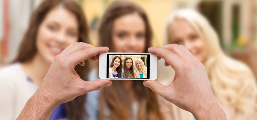 Canvas Print - close up of hands taking picture with smartphone