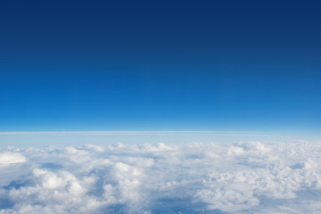 Wall Mural - above the clouds photo of puffy clouds