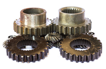 A group of interlocking metal gears on a white background.