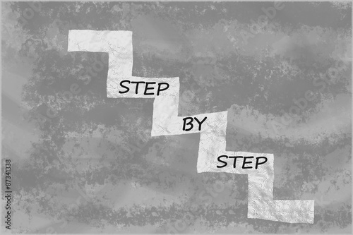 Fotografie, Obraz Step by step written on stairs over abstract grey background