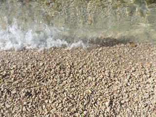 Wave on stone beach