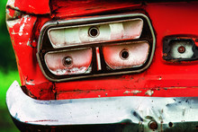 Closeup Image Of Vintage Rusty Red Car Headlight