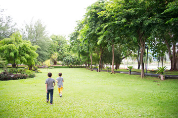 Little boy running  in the park