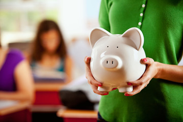 Wall Mural - Students: Girl Holding Piggy Bank