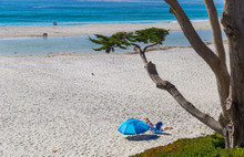 People Sunbathing At Beach In Carmel-by-the-Sea, California