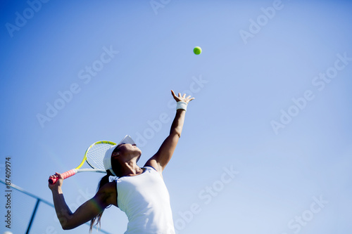 Fotografia, Obraz Beautiful female tennis player serving