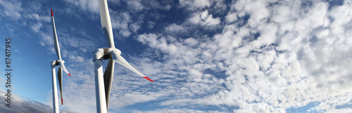 Fotografía energy wind turbines on blue sky with clouds