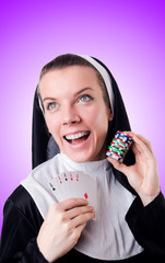 Wall Mural - Nun in the gambling concept