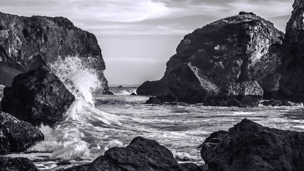 Wall Mural - Waves Crashing on a Rocky Coast, Black and White