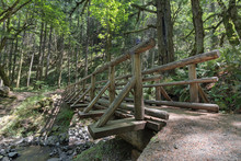 Wood Log Bridge Over Gorton Creek In Oregon