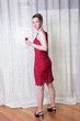 © Jürgen Hüls - woman in red dress with glass in her hand