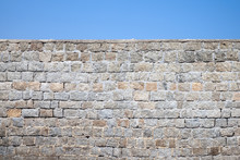 Old Gray Stone Wall And Blue Sky