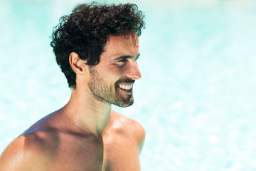 Wall Mural - Young man relaxing while taking the sun