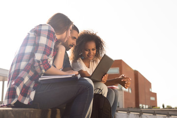 Students with laptop in Campus