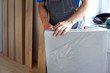 male carpenter selects a substrate for laminate