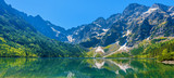 Fototapeta  - Panoramic view of green water Morskie Oko lake, Tatra Mountains, Poland
