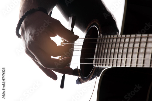 Acoustic guitar close-up with fingers playing it Poster