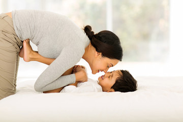 Wall Mural - indian mother playing with her little boy