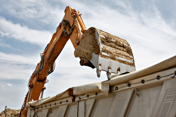 Wall Mural - excavator loads sand