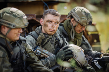 Portrait of a ranger in the battlefield with a gun