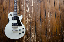 Les Paul Guitar On Wooden Background