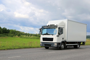 Wall Mural - White Commercial Delivery Truck on the Road