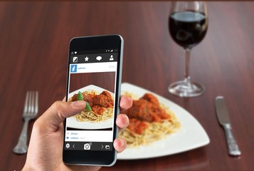 Poster - Composite image of hand holding smartphone