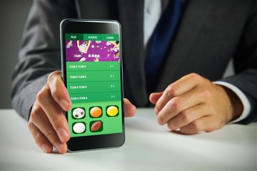 Poster - Composite image of businessman using smartphone