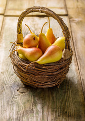 Wall Mural - Ripe pears in a basket