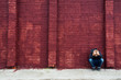 © mizina - Depressed child and brick wall