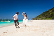 © photopixel - Bride and groom  having fun on beach