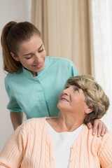 Wall Mural - Professional carer nursing senior lady