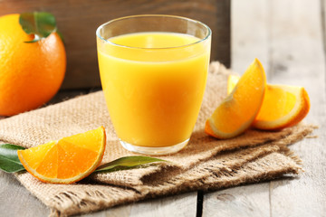 Wall Mural - Orange juice on table close-up