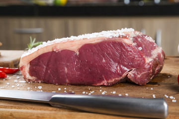 Organic Red Raw Steak Sirloin on wooden board