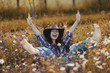 © kichigin19 - Happy American woman in a cowboy hat field wild flowers