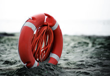 Orange Jackets With Rope To Rescue Swimmers In The Sea In Summer