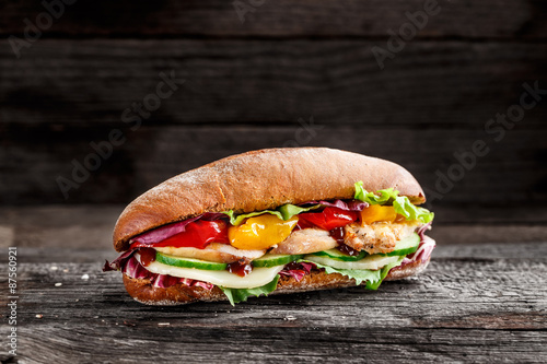 Fotografie, Obraz Sandwich with chicken, cheese and vegetables