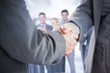 © vectorfusionart - Composite image of business people shaking hands close up