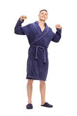 Sticker - Young man in a blue bathrobe stretching himself